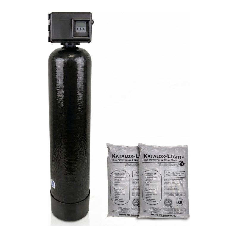 Black iron filter tank with a Fleck control valve, next to two bags of Katalox Light media